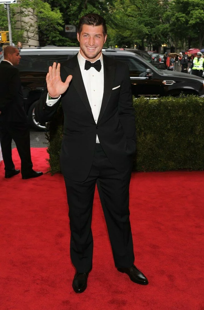 143999647 10 673x1024 Tim Tebow, Victor Cruz & Amare Suit Up For 2012 Met Gala! (PHOTOS)